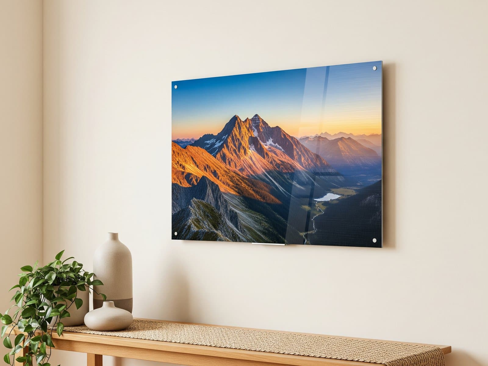 Open hardcover photo book on a desk beside neatly stacked fine-art prints, suggesting a professional photo lab's range of products