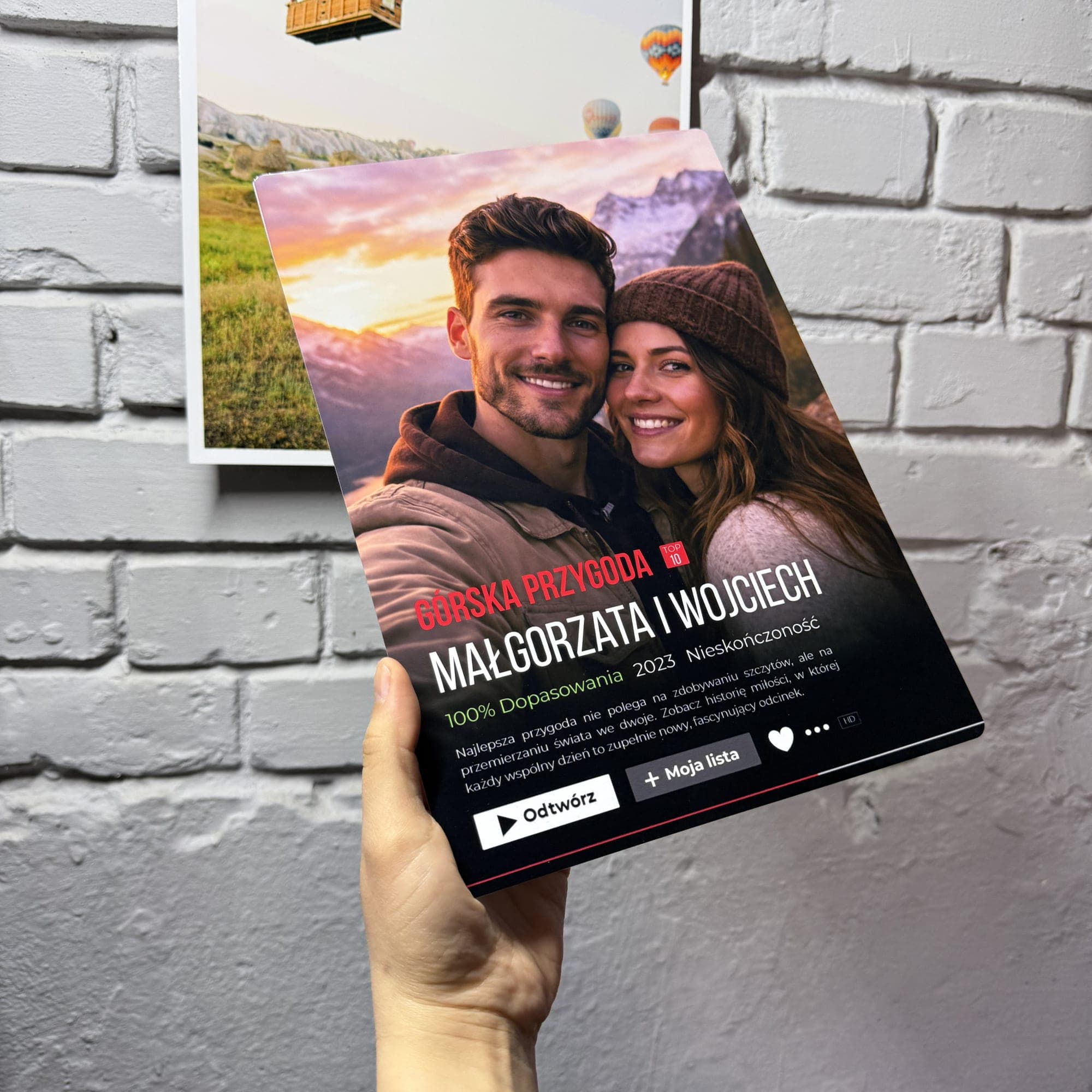 Portrait orientation Cinematic Print held in hand showing vivid colours
