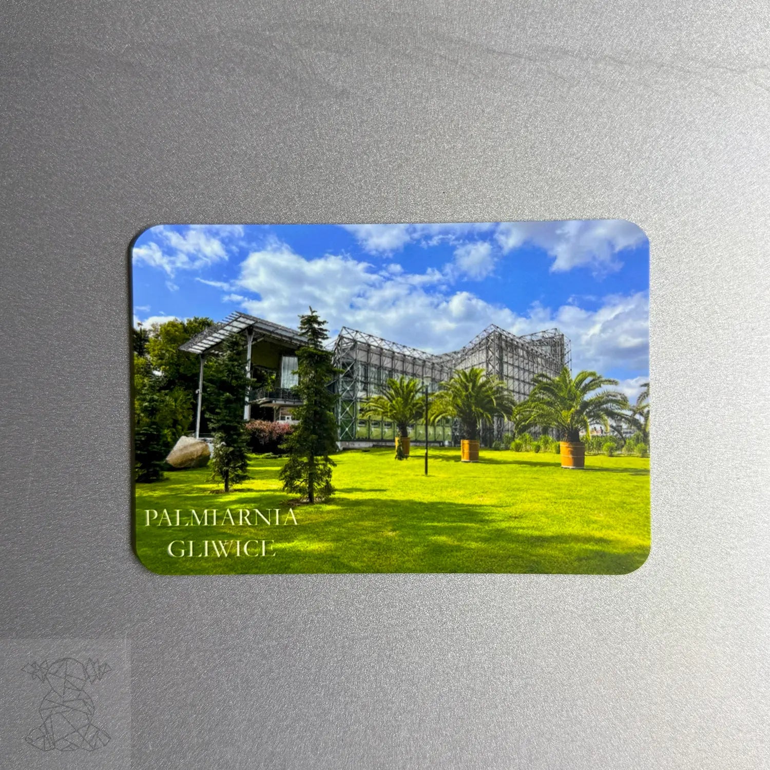 Custom magnet featuring Palmiarnia Gliwice surrounded by palm trees and a clear sky — a perfect Polish-themed souvenir metal print.